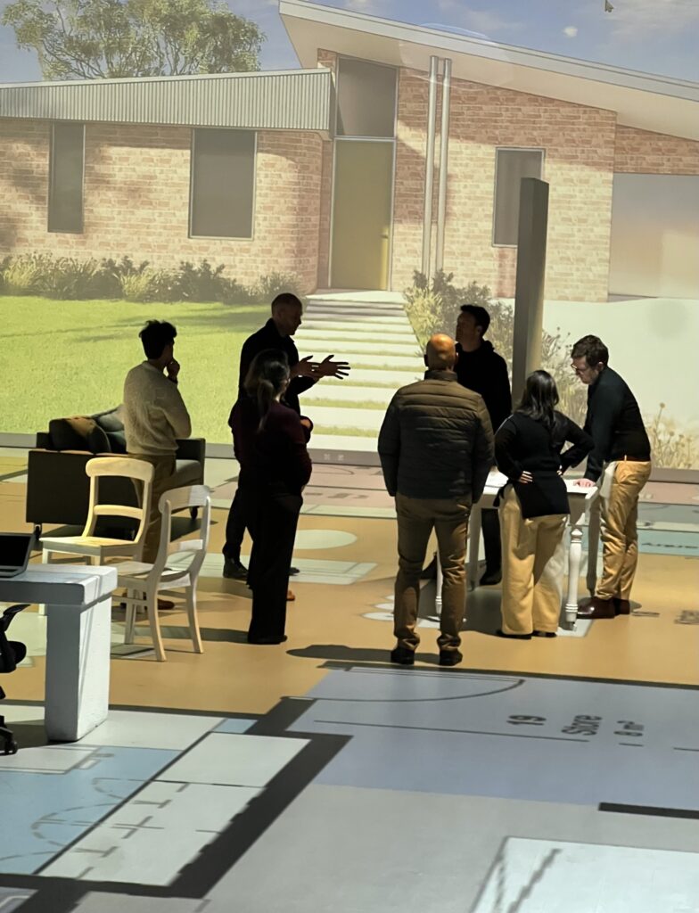 Room size on a floor plan reviewed during a full-size walkthrough